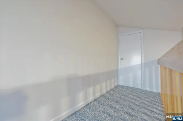 a view of a door and wooden floor