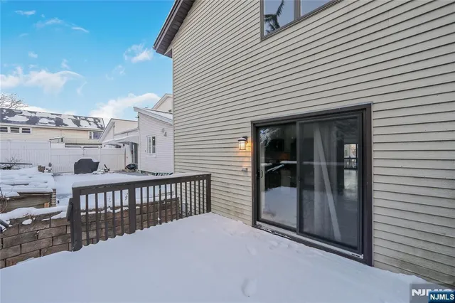 a view of a backyard with large trees