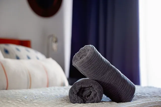 a bathroom with a granite countertop sink a mirror and a shower