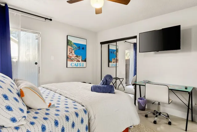 a bedroom with a bed and window