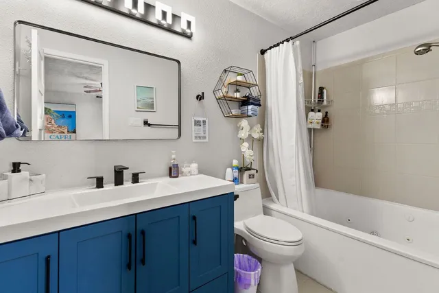 a bedroom with a bed and a television