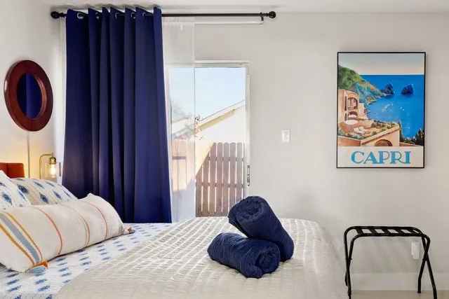 a bedroom with a bed and a television