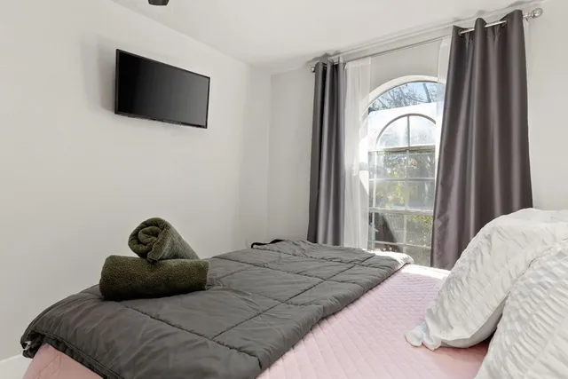 a backyard of a house with table and chairs