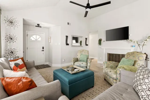 a kitchen with stainless steel appliances a refrigerator stove and white cabinets