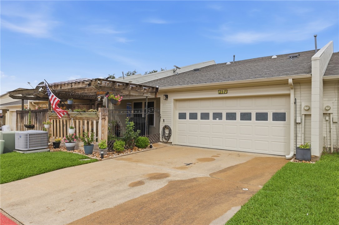 1520 Bennett Street Bryan, TX 77802 - Photo 21 of 24 a front view of a house with a garden