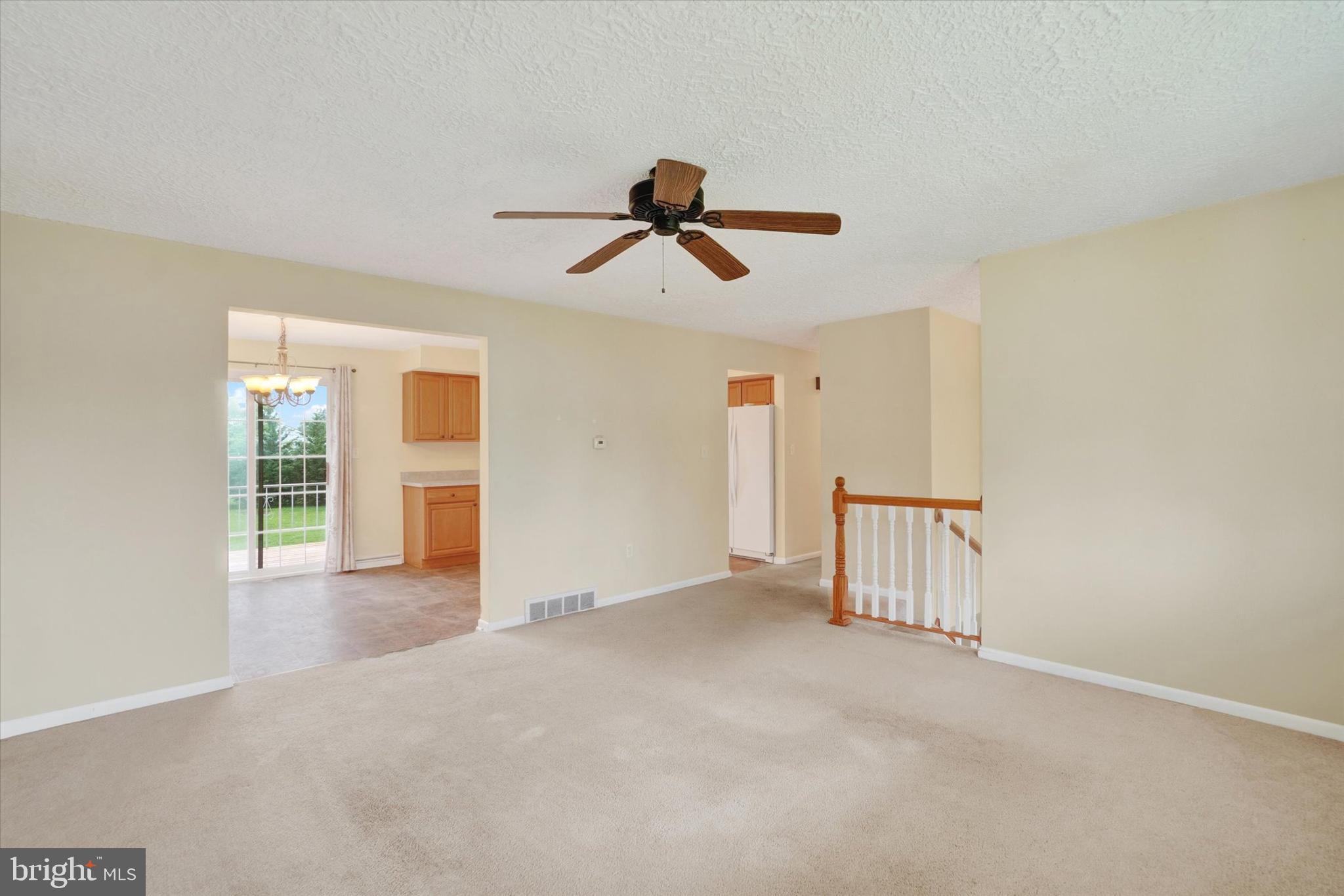 48 Singer Road New Freedom, PA 17349 - Photo 8 of 27 a view of a livingroom with a ceiling fan and window