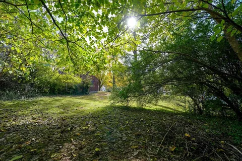 a view of outdoor space with deck and yard