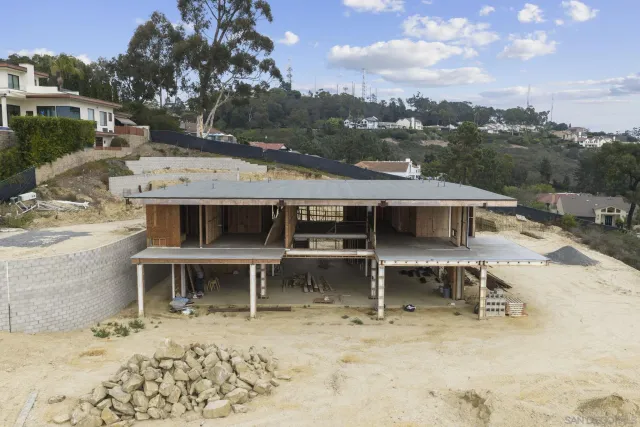 a view of a house with a bench