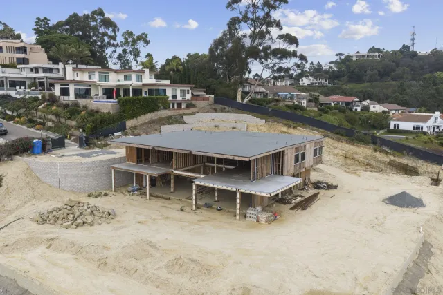 a view of a patio with table and chairs with wooden fence