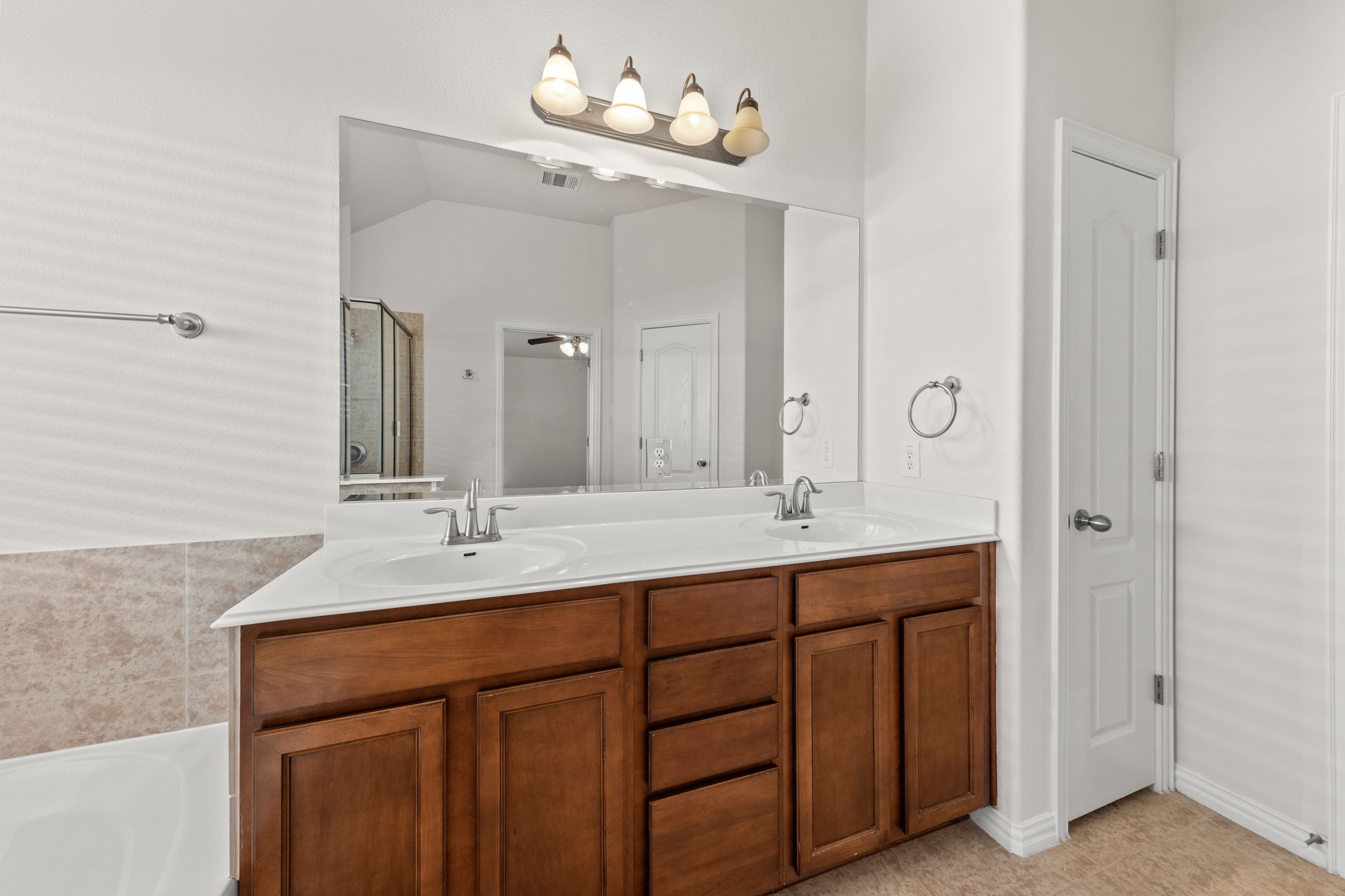411 Tascate Street Georgetown, TX 78628 - Photo 23 of 41 Double vanity offers ample space, complementing the clean lines of this bathroom.