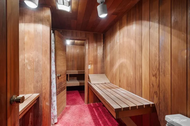 a view of room with wooden floor and cabinet