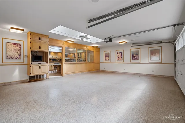 a view of a house with backyard and a tree