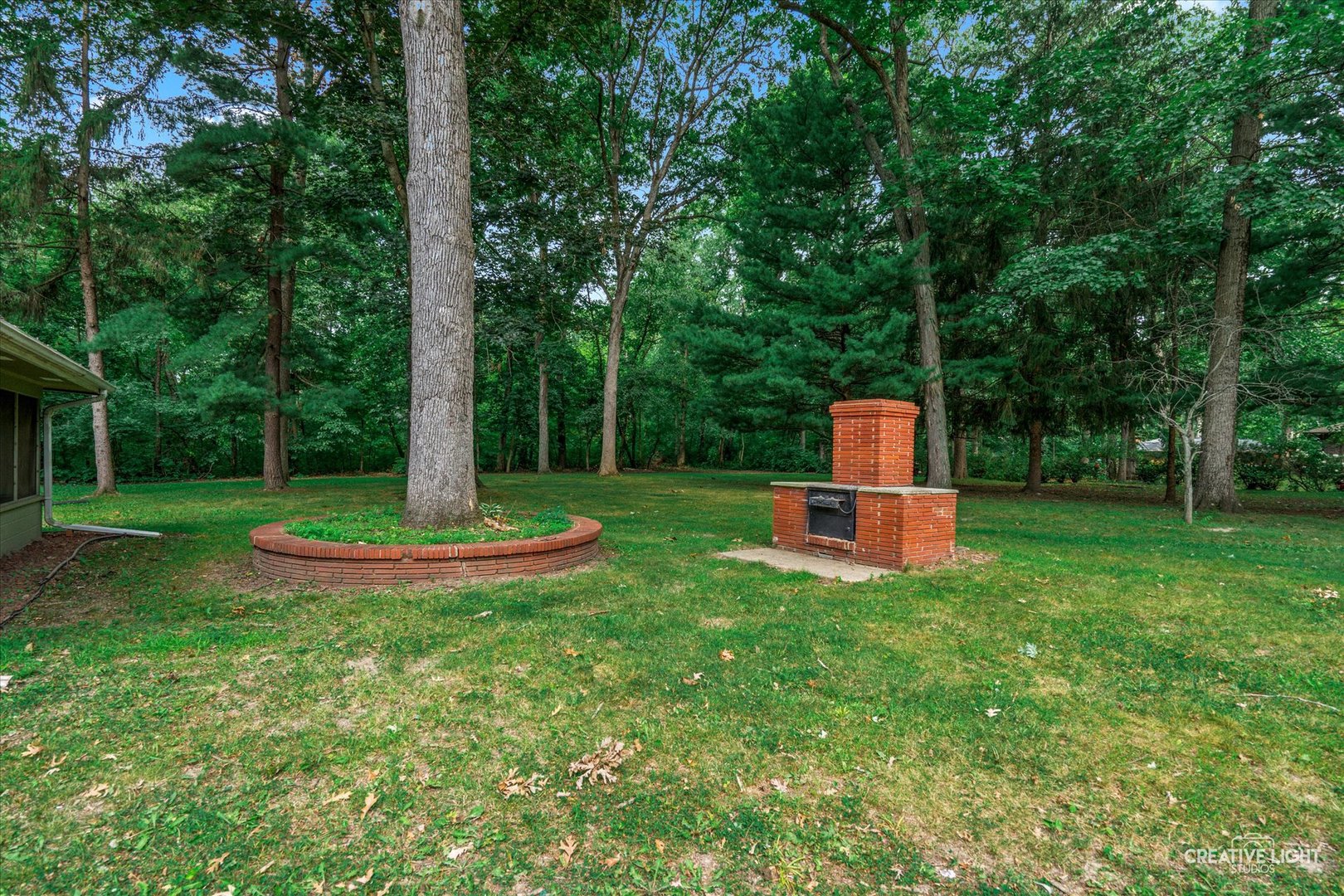 16323 Griswold Springs Road Plano, IL 60545 - Photo 43 of 55 a view of a garden with a slide