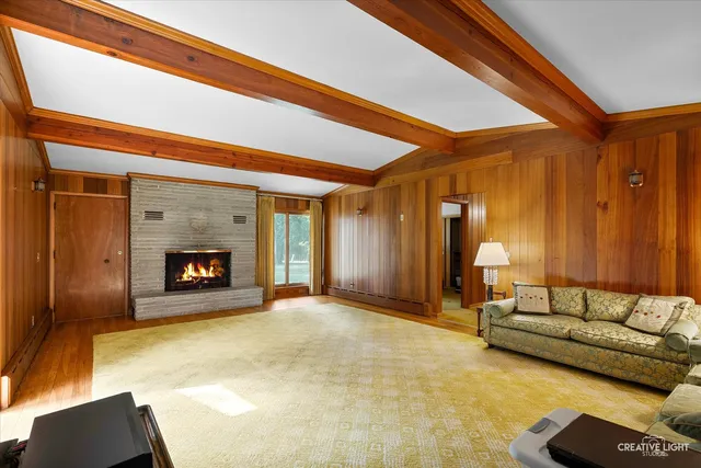 a spacious bedroom with a bed and a fireplace