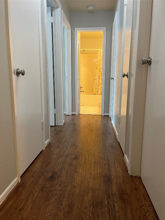 9217 Carousel Lane Houston, TX 77080 - Photo 24 of 38 a view of a hallway with wooden floor