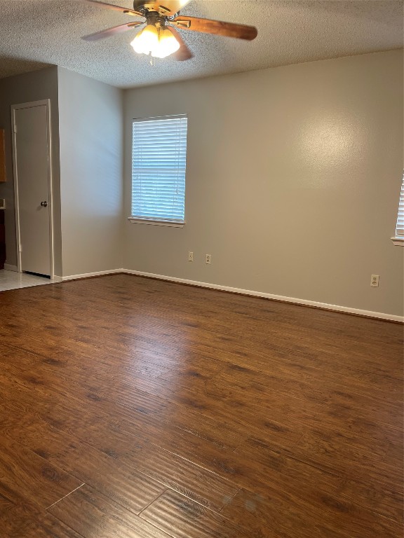 9217 Carousel Lane Houston, TX 77080 - Photo 25 of 38 an empty room with wooden floor and windows