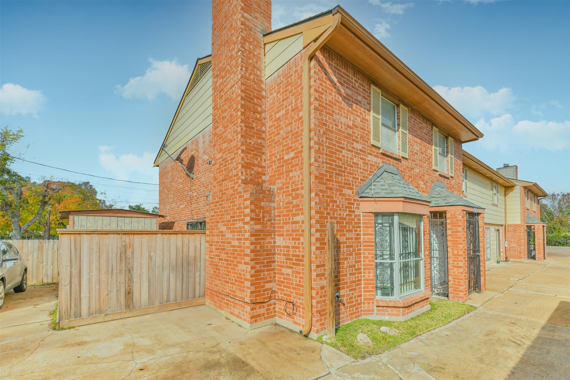 9217 Carousel Lane Houston, TX 77080 - Photo 3 of 38 a view of a house with wooden fence