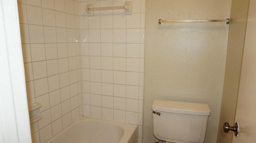 9217 Carousel Lane Houston, TX 77080 - Photo 31 of 38 a bathroom with a shower and toilet