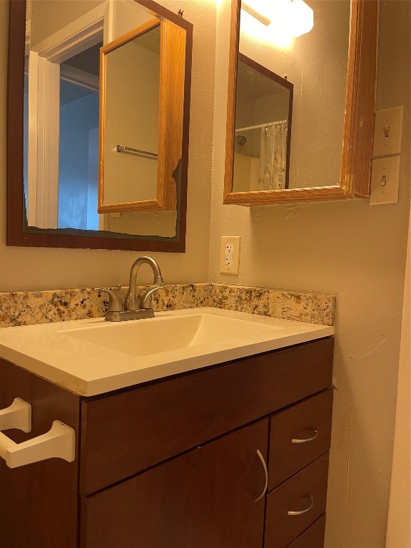 9217 Carousel Lane Houston, TX 77080 - Photo 35 of 38 a bathroom with a sink and a mirror