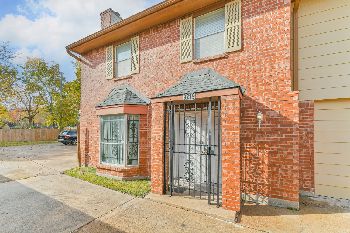9217 Carousel Lane Houston, TX 77080 - Photo 6 of 38 a view of a brick house with a large windows
