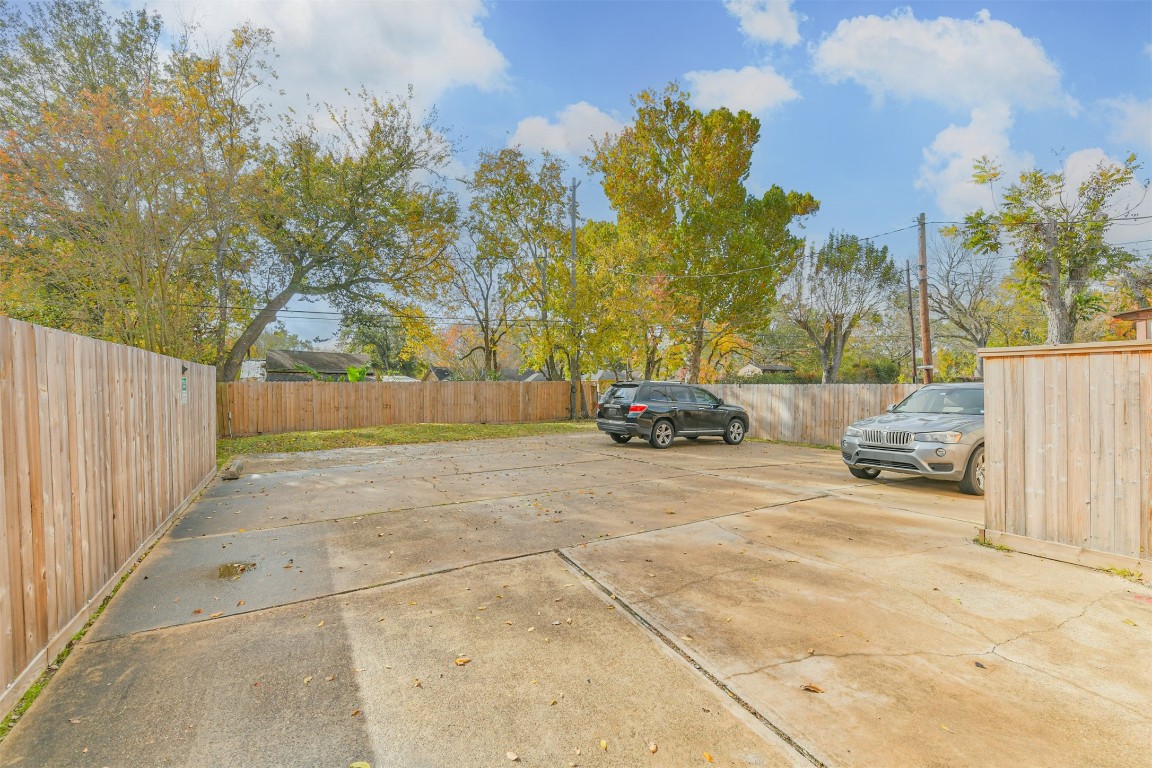 9217 Carousel Lane Houston, TX 77080 - Photo 8 of 38 a view of backyard with parked car