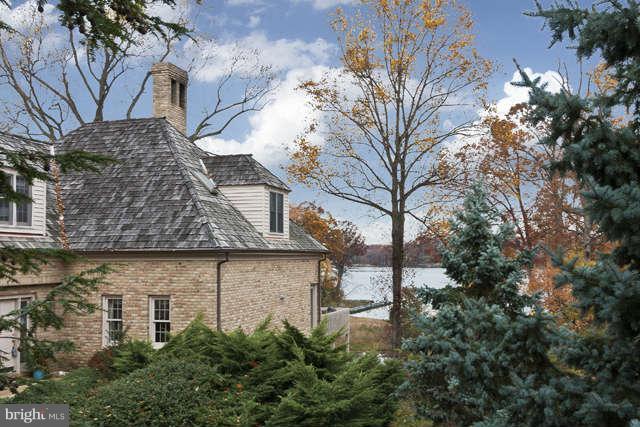 310 South River Landing Road, Unit 310 Edgewater, MD 21037 - Photo 2 of 30 a view of a stone house with a yard