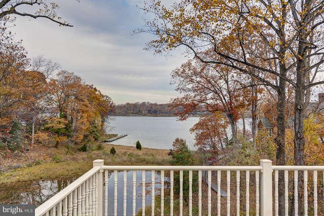 310 South River Landing Road, Unit 310 Edgewater, MD 21037 - Photo 18 of 30 a balcony with wooden floor and lake view
