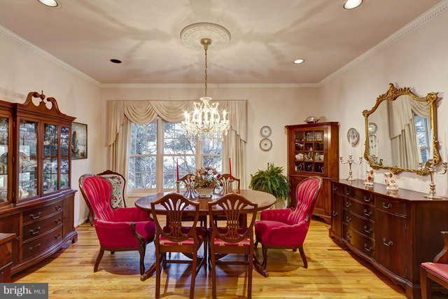 310 South River Landing Road, Unit 310 Edgewater, MD 21037 - Photo 4 of 30 a dining room with furniture a chandelier and window