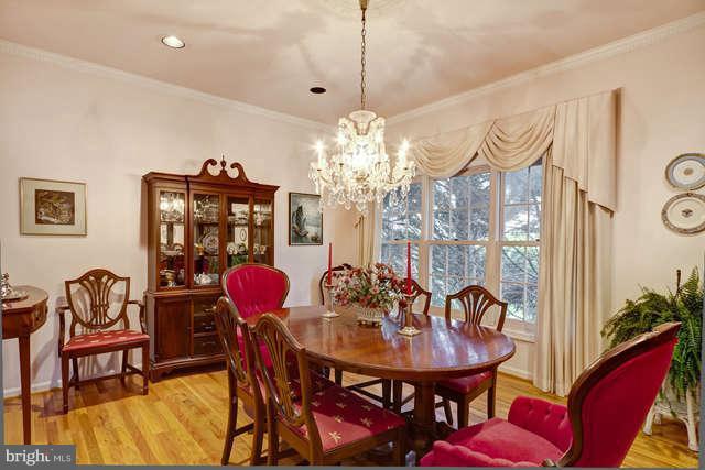 310 South River Landing Road, Unit 310 Edgewater, MD 21037 - Photo 5 of 30 a view of a dining room with furniture and chandelier