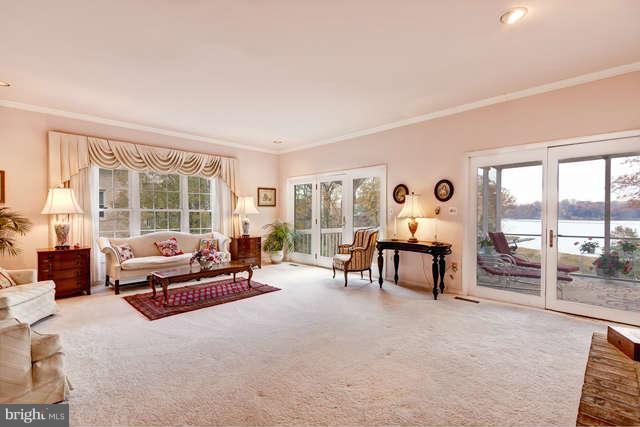310 South River Landing Road, Unit 310 Edgewater, MD 21037 - Photo 6 of 30 a living room with furniture and a large window