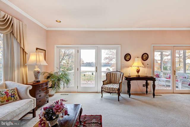 310 South River Landing Road, Unit 310 Edgewater, MD 21037 - Photo 7 of 30 a living room with furniture and a large window