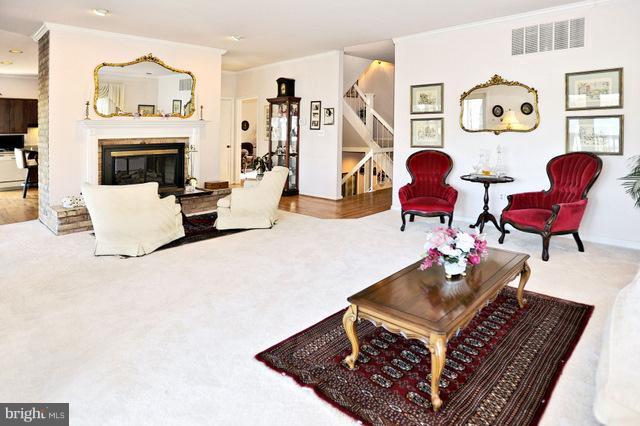 310 South River Landing Road, Unit 310 Edgewater, MD 21037 - Photo 9 of 30 a living room with furniture and wooden floor