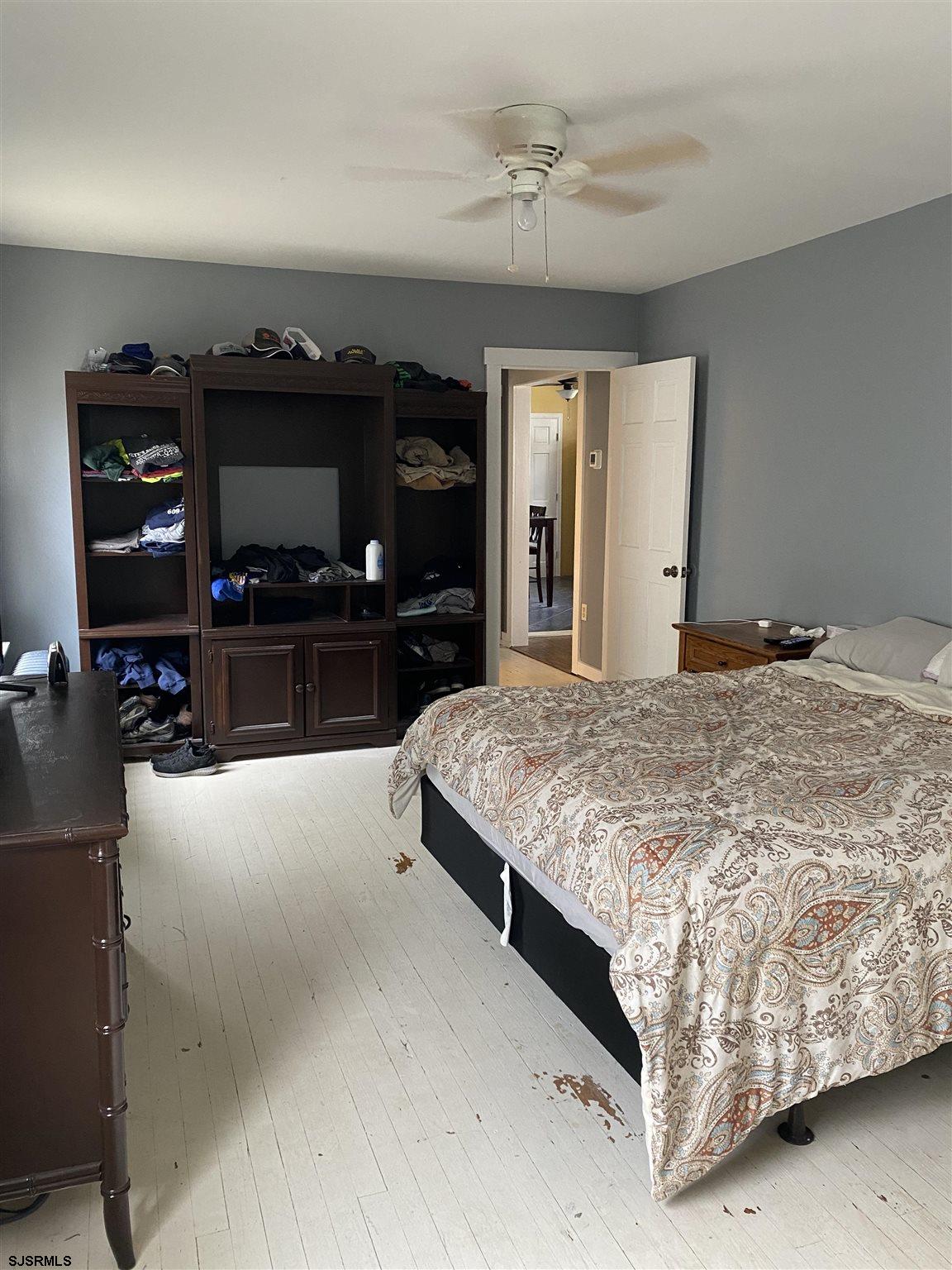 237 Marlin Road Absecon, NJ 08201 - Photo 11 of 25 a spacious bedroom with a bed and a flat screen tv
