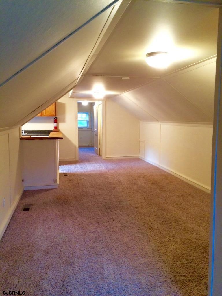 237 Marlin Road Absecon, NJ 08201 - Photo 13 of 25 a view of a big room with wooden floor and windows