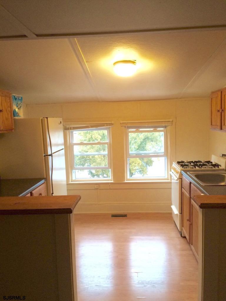 237 Marlin Road Absecon, NJ 08201 - Photo 19 of 25 a view of a kitchen with a sink and wooden floor