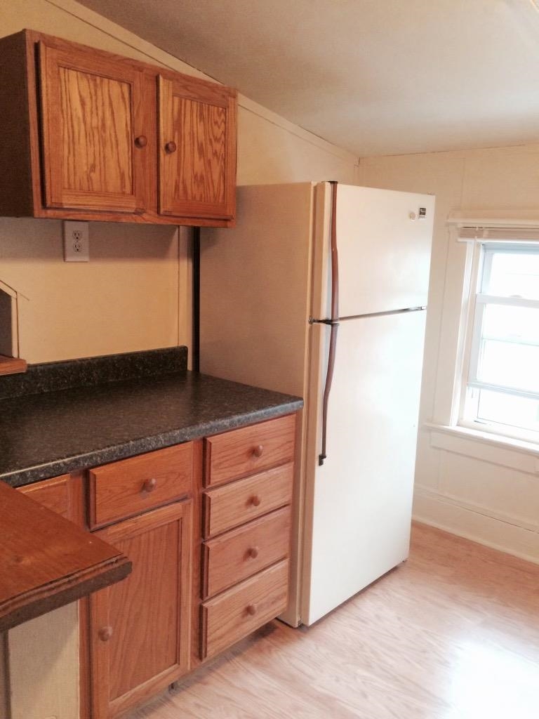 237 Marlin Road Absecon, NJ 08201 - Photo 21 of 25 a kitchen with cabinets and a refrigerator