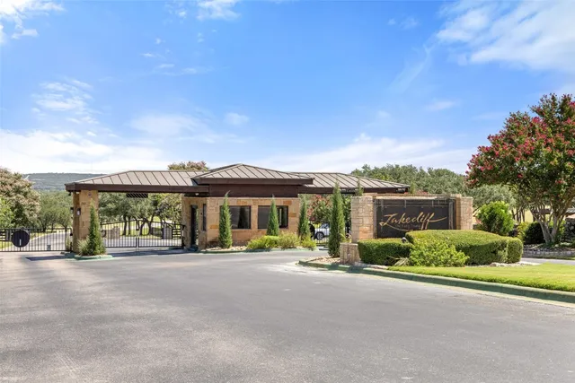 an aerial view of a houses with a lake view
