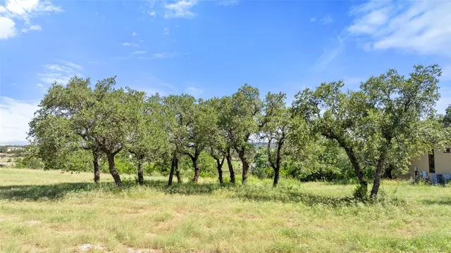 a view of a lake with houses in the back
