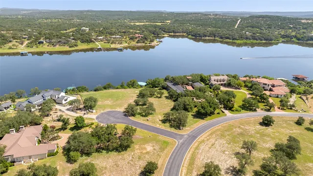 an aerial view of ocean with residential house and lake view