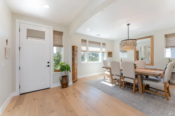 a view of a dining room with furniture window and wooden floor
