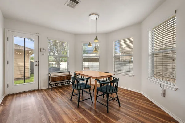 a dining room with furniture window wooden floor
