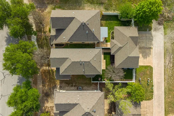 an aerial view of a house with swimming pool