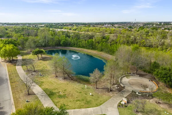 a view of a lake with a yard