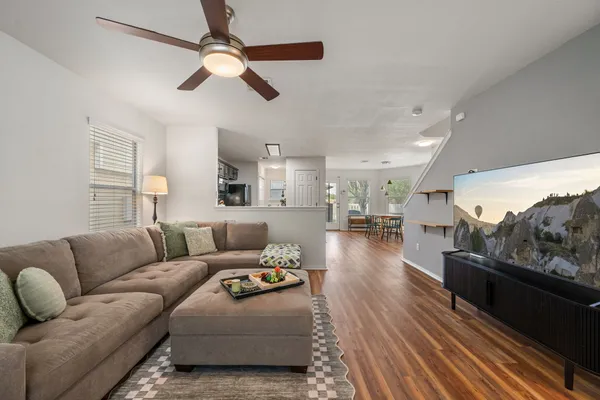 a living room with furniture and a flat screen tv