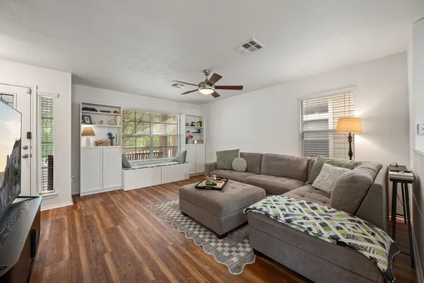 a living room with furniture and a large window