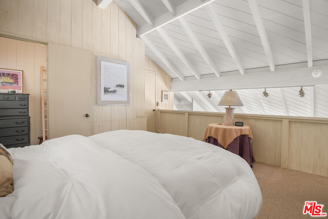 31649 Sea Level Drive Malibu, CA 90265 - Photo 14 of 26 a bedroom with a bed and a table