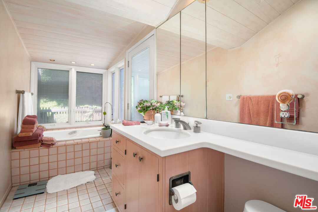 31649 Sea Level Drive Malibu, CA 90265 - Photo 16 of 26 a bathroom with a sink and a mirror