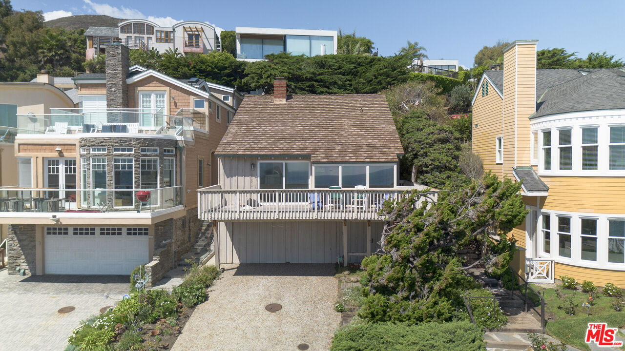 31649 Sea Level Drive Malibu, CA 90265 - Photo 4 of 26 a front view of a house with a yard and potted plants