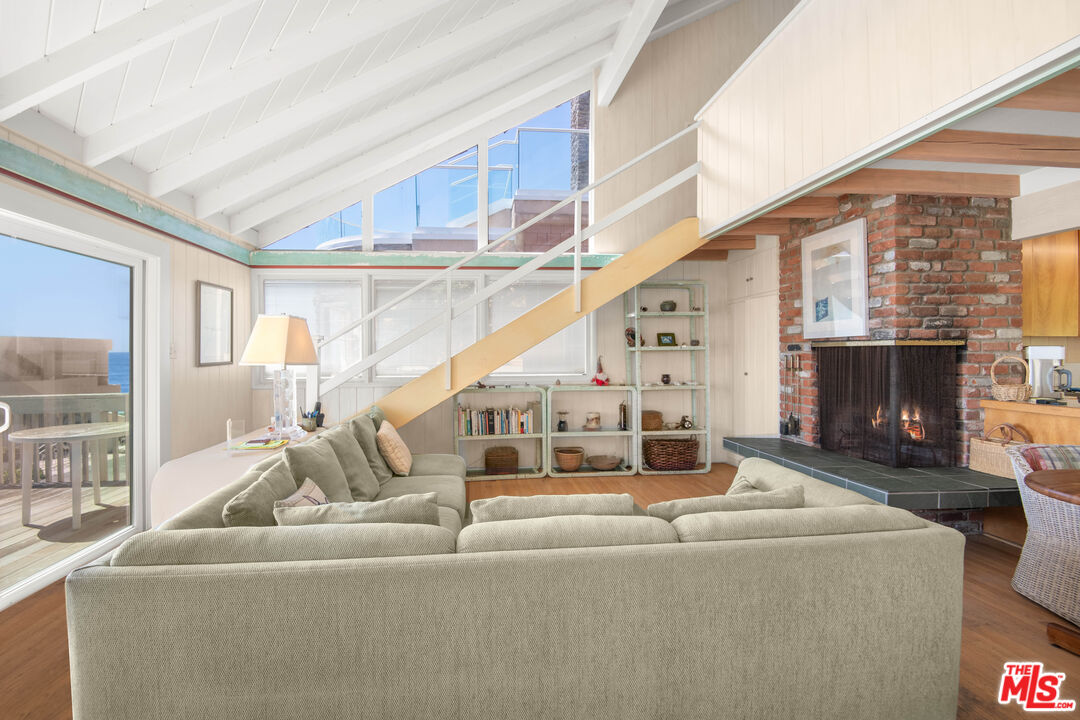 31649 Sea Level Drive Malibu, CA 90265 - Photo 8 of 26 a living room with furniture and a fireplace
