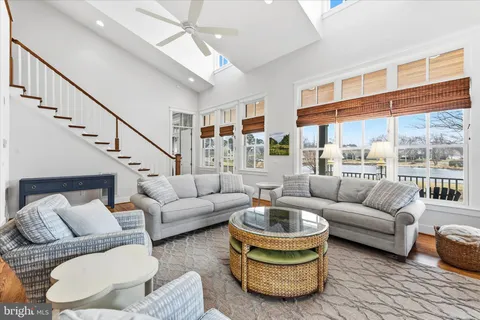 a bathroom with a sink mirror vanity and toilet